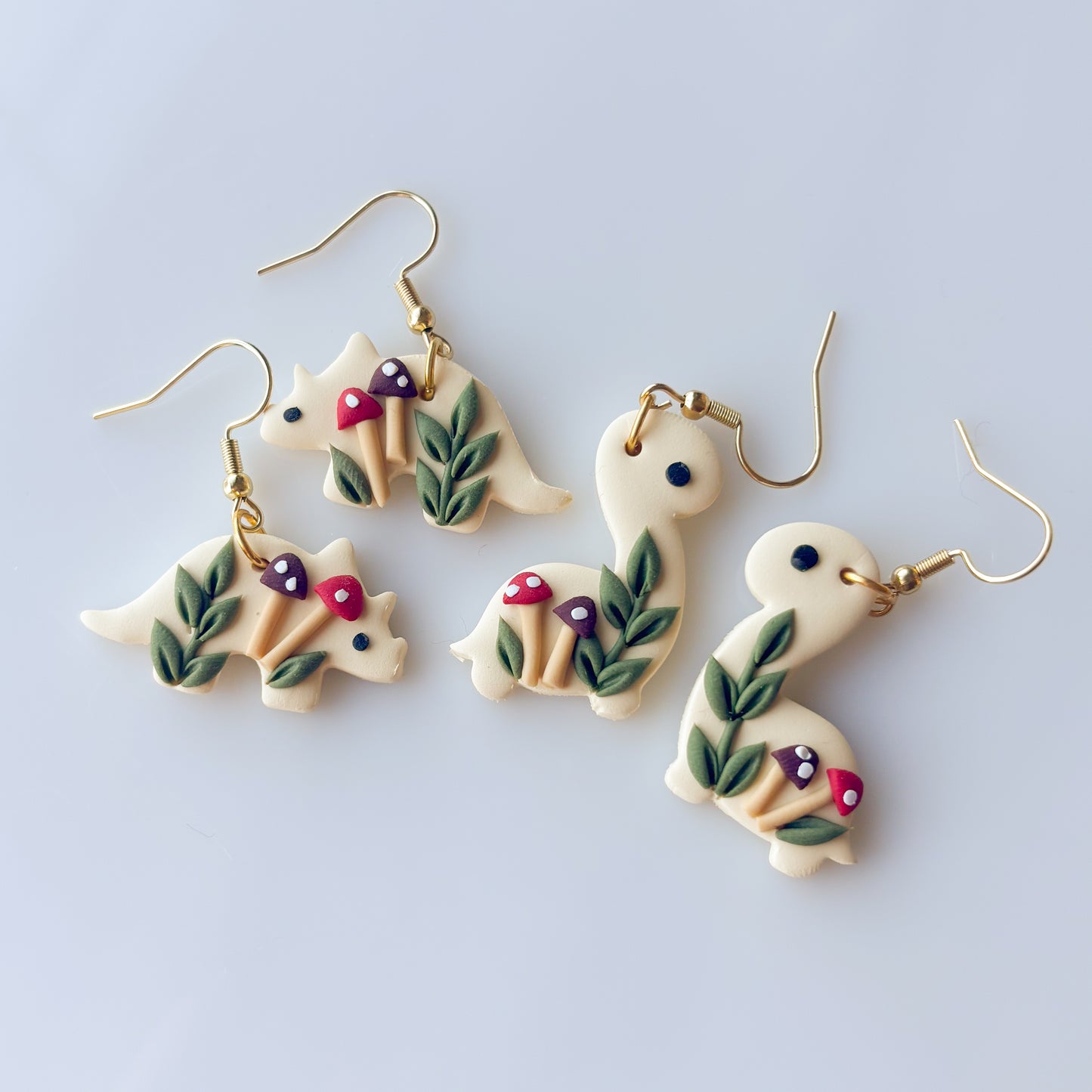 RED MUSHROOM DINO EARRINGS (TRICERATOPS)